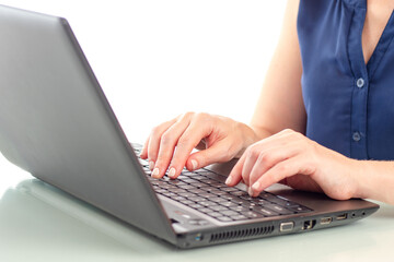 Businesswoman laptop. Hands are typing on keyboard. Women's hands on keys. Businesswoman use computer. Laptop close up. Concept of using computer for business. Using laptop for business tasks