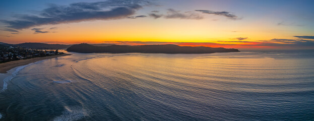 Fototapeta na wymiar Sunrise seascape panorama with clouds