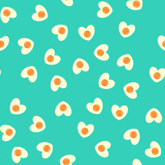 Seamless pattern with heart shaped egg. Abstract Valentine's Day pattern with fried eggs. Random, chaotic blue background with cute omelette.
