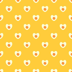 Seamless pattern with heart shaped egg. Abstract Valentine's Day pattern with fried eggs. Yellow background with cute omelette.