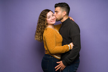 Passionate man kissing his girlfriend