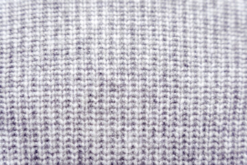 Gray knitted polyester and acrylic knit sweater fabric texture