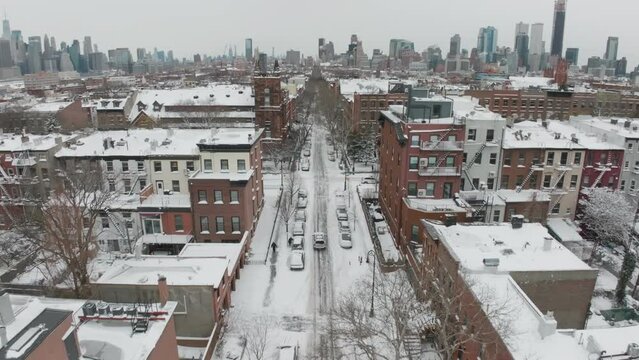 flying forward over snow covered Clinton St. in Carroll Gardens Brooklyn