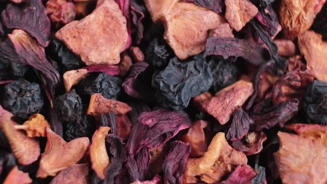 HD Wild berry tea. Mixture of healthy herbal Organic Dry Chai . Macro. Rotation.