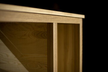 Furniture details. Board in carpentry workshop. Making cabinet from wood. Object is in workshop.