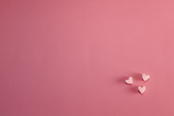 Heart made of marshmallows on a pink background. Happy Valentine's Day, Mother's Day, 8 March, World Women's Day. Copy space. The concept of holidays and love. Flatlay. Top view.