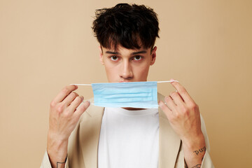 portrait of a young man protective mask in hand in hand modern style Lifestyle unaltered