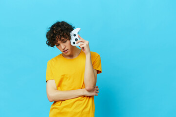 curly guy in headphones plays games gamepad isolated backgrounds