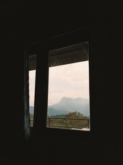 Beautiful mountain view from the window in the old house