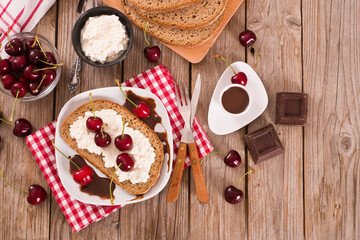 Rye bread with cottage cheese and cherries.