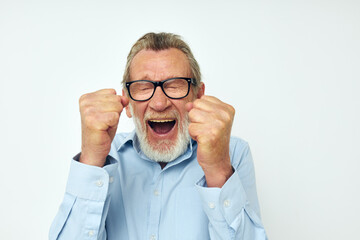 elderly man in shirt and glasses posing emotions isolated background