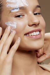 Portrait Woman face mask cream clean skin facial scrub close-up