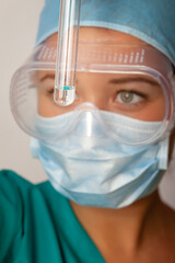 Young chemist student working in lab on chemicals