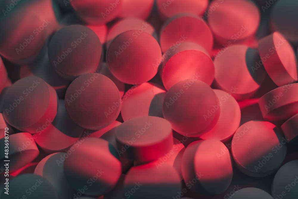 Poster pills or drugs in a package under neon light. beautiful background pattern for design.