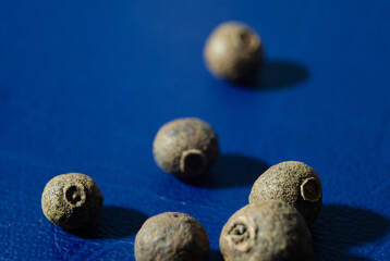 macro pepper on blue skin