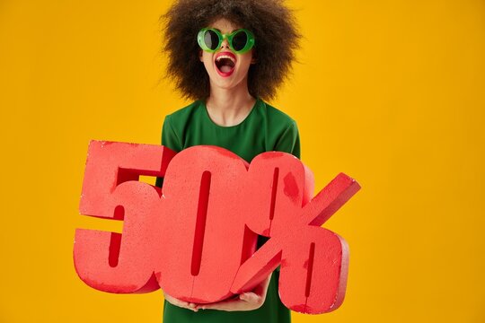 Pretty young female curly hairstyles green dress fifty percent discount color background unaltered