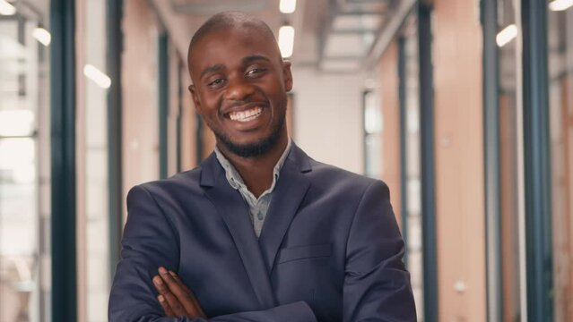 4k video footage of a handsome businessman looking at the camera