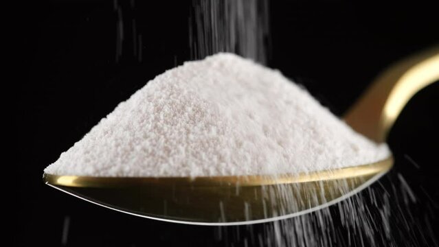 Collagen. Pouring collagen powder in golden spoon. Stylish video with collagen. Natural beauty and health supplement