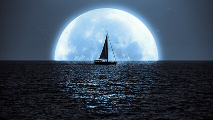 Full Moon and Millky way rising above ocean sea horizon with sailing boat silhouette.