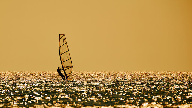 Windsurfer on the open sea ocean waters.