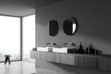 Dark bathroom interior with sinks and mirrors, decoration on deck and window