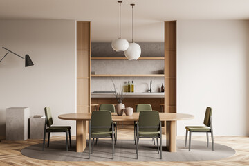 Light kitchen interior with chairs and table, dining room and appliances