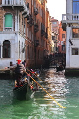 Fototapeta na wymiar A gondola on a small canal in Venice, Italy, Europe.