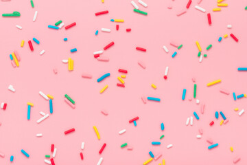 modern trendy pattern of colorful sprinkles for background of design banner, poster, flyer, card, postcard, cover, brochure over pink