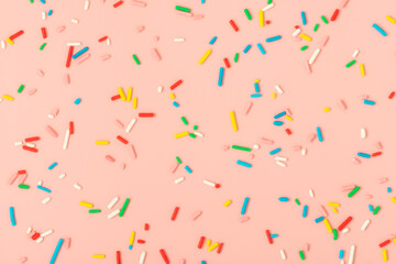 modern trendy pattern of colorful sprinkles for background of design banner, poster, flyer, card, postcard, cover, brochure over pink