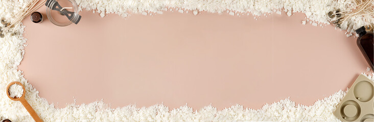 Flatlay with organic white soy wax flakes, wicks, flavor and tools for candle making. Diy, hobby idea. Top view, banner, copy space