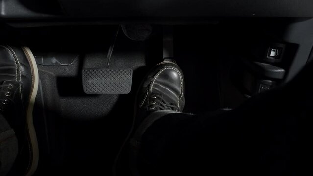 Accelerate and Brake. Foot pressing foot pedal of a car to drive ahead. Accelerator and brake pedal in a car. Driver driving the car by pushing accelerator pedals of the car. inside vehicle automobile