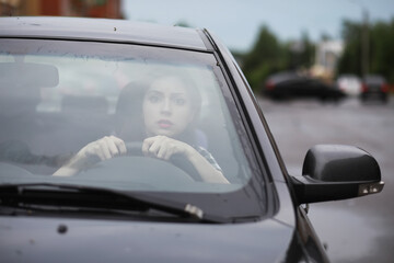 Girl driving a car bad emotions