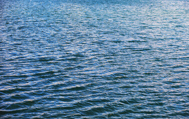 Water surface. The texture of the water. Waves on the lake in windy weather.