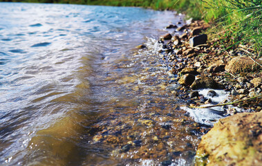 Water surface. The texture of the water. Waves on the lake in windy weather.
