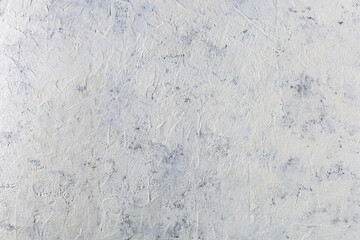 Empty light white concrete background. Rough old grainy stone texture