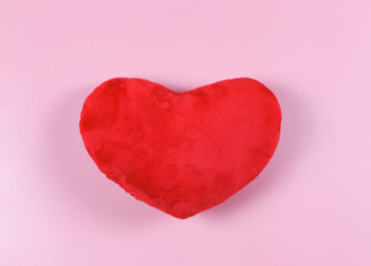 flat lay of red heart pillow on pink background, isolated. Valentine's day concept.