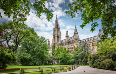 Fototapeta na wymiar Parks of Vienna, Austria, view with City hall. Summer day. The Vienna City Hall is located on Friedrich Schmidt Square in the 1st arrondissement, Vienna.