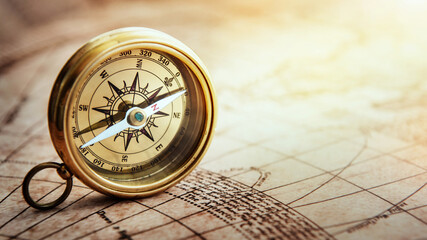 Magnetic old compass on world map. Travel, geography, navigation, tourism and exploration concept...