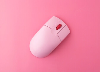 pink computer wireless bluetooth mouse on pink background