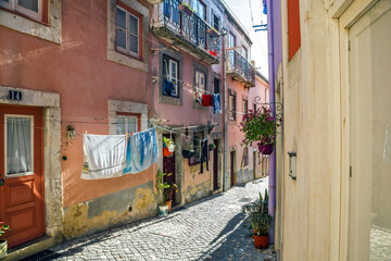 Fototapeta na wymiar Alfama Lisboa district narrow street colored houses. Lisbon, Portugal