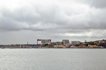 Naklejka premium Lisboa Tago River in a cloudy day. Lisbon, Portugal