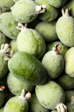 A macro view of freshly picked feijoa fruit