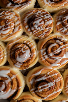 Cinnamon Roll pastries covered in drizzled icing