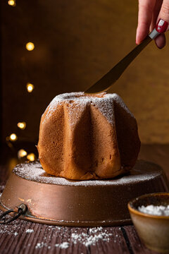 Hand Cutting A Small Pandoro