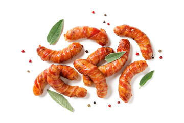 Appetizing sausages wrapped in bacon. Holiday food. Isolated on white background. Top view.	
