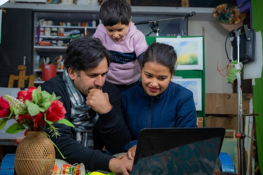 parents teaching our child from laptop .