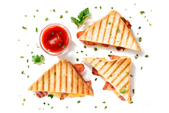 Delicious Toasted Sandwiches With Cheddar Cheese And Bacon Isolated On White Background, Top View