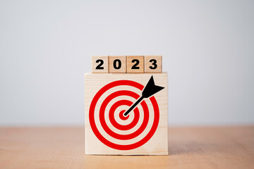 2023 year with target which print screen on wooden cube block for setup business target concept.