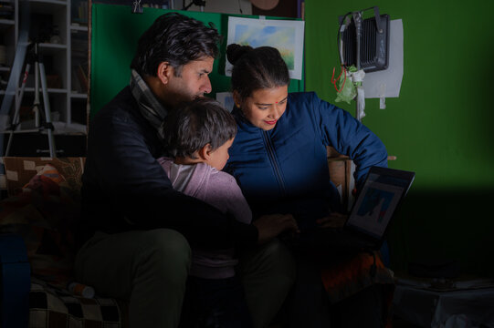 parents teaching our child from laptop .