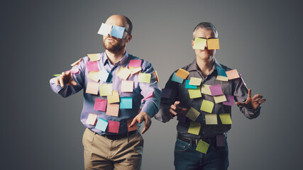 Zombie men covered with sticky notes
